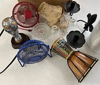 Group shot showing fans, drums, sconces, trophy, vent kit, glass chimneys, lamp shade