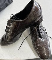 Pair of brown crocodile-pattern lace-up dancing shoes