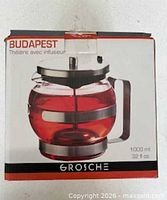 Front of retail box showing image of teapot, brand, capacity 1000 ml / 32 fl oz