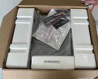 Receiver packed in styrofoam with remote and manual