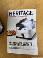 Instruction manual showing Heritage 1.5 L compact deep fryer image