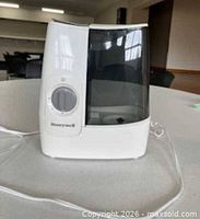 Front view of Honeywell cool-mist humidifier showing housing and water tank