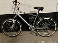 Left side view of KHS TC150 bicycle with lock and kickstand visible