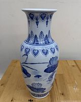 Full view of vase front showing floral and koi motifs