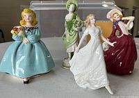 Group shot showing all four figurines front view