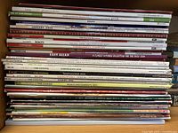 Full stack of cooking magazines on shelf