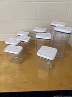 All nine clear OXO canisters grouped on table