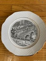 Front view showing Pulteney Bridge transfer print, scalloped edge and gold trim