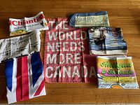 All six cotton tea towels laid out showing various designs