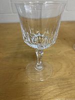 Single clear cut crystal wine glass showing bowl pattern, stem and base