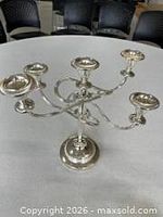 Full view of silver-tone five-arm candelabra showing design and condition