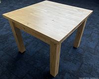 Three-quarter view of entire table showing legs and top