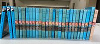 All 27 Hardy Boys books lined side-by-side, spine view