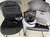 Overall lot showing car seat pad, two neck pillows with pouches, two LavaSeat cushions