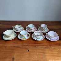 Group shot of seven teacup and saucer sets