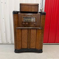 Full view of GE JK-76 console radio with turntable lid closed