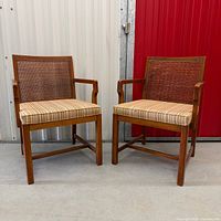 Two cane back wooden armchairs front and side view