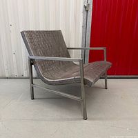Front angled view of stainless steel lounge chair