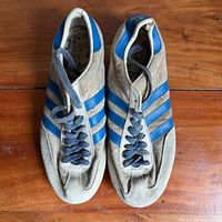 Top view of pair showing uppers, laces, suede condition, blue stripes