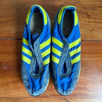 Top view showing blue nylon uppers, yellow stripes, grey suede toe, missing laces