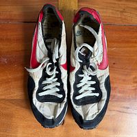 Top view of both shoes showing laces, uppers and wear