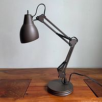 Full view of lamp extended on desk
