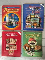 All four collector guide books laid out