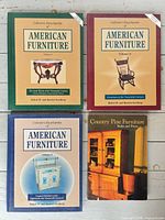 Four books laid out showing front covers