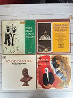 Four Count Basie LP covers laid out on table