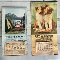 Both calendars hanging side by side showing full fronts and dates