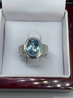 Front view of aquamarine sterling ring in box