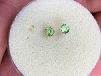 front view of both peridot studs showing color and cut