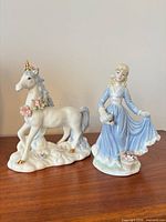 Front view of both porcelain figurines showing details and scale