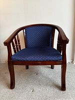 Front view showing full chair, wood frame, upholstery