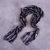 Full view of scarf laid out on floor