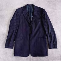 Front view of navy pinstripe blazer