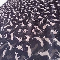 Close-up of cat silhouette pattern on scarf