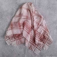 Full view of square scarf showing plaid pattern and size