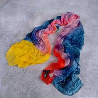 Full view of multicolour silk scarf laid out showing gradient design