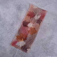 Full view of rectangular silk scarf on floor
