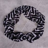 Infinity scarf laid in circle displaying full loop