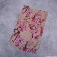 Full view of folded scarf showing overall print and size perspective