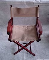 Full front view of teak director’s chair showing frame and Sunbrella seat/back