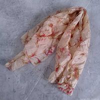 Scarf loosely folded showing floral pattern and fabric texture