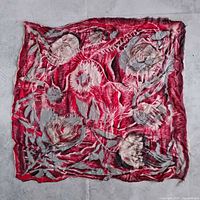 Full view of square silk scarf showing red and gray floral design