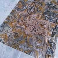 Full section of scarf showing overall baroque tile pattern