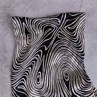 Scarf fabric close-up showing swirl zebra pattern