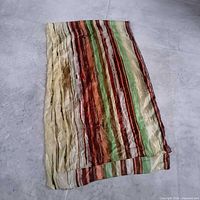 Scarf folded showing full length and stripe pattern