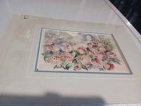 Full view of matted watercolor print in plastic wrap