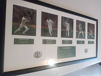 Full framed print showing five player images, text panels, emblems